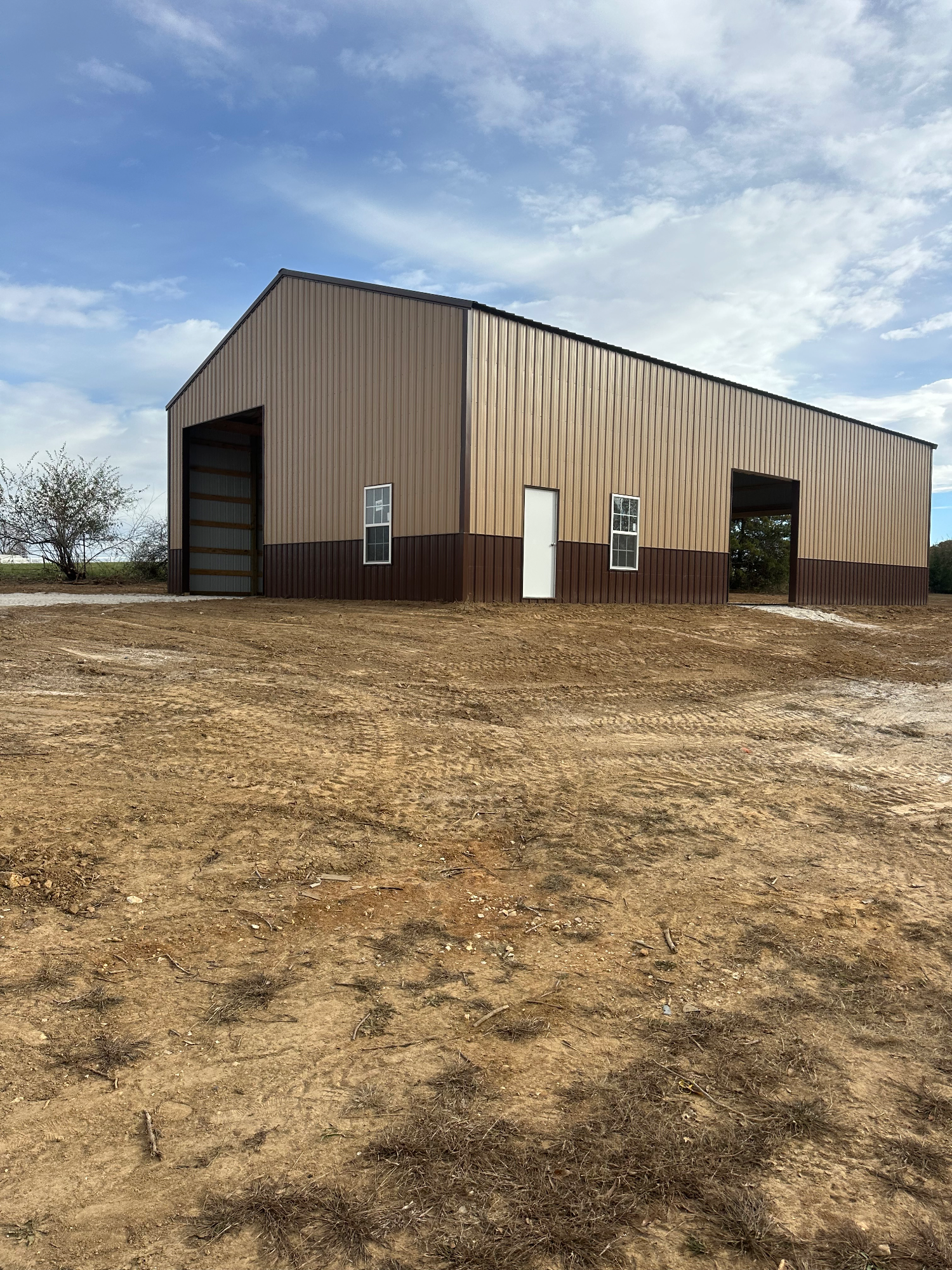 Corrected building pad graded to proper elevation with clean slopes around structure