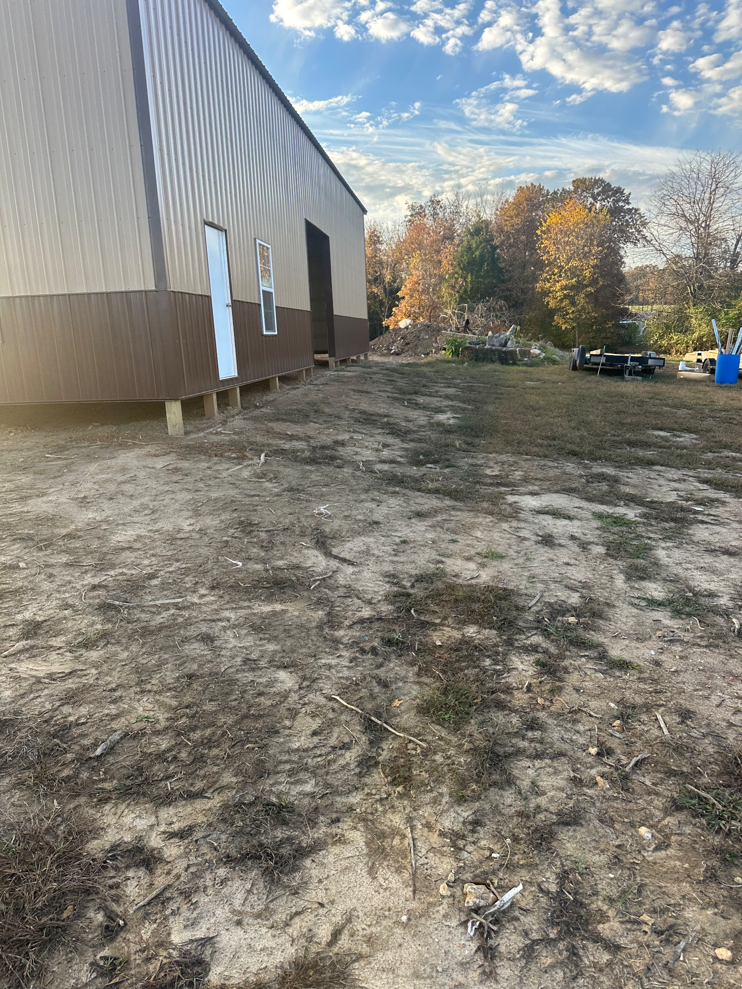 Building pad at wrong elevation with grading errors around existing structure in Silex MO