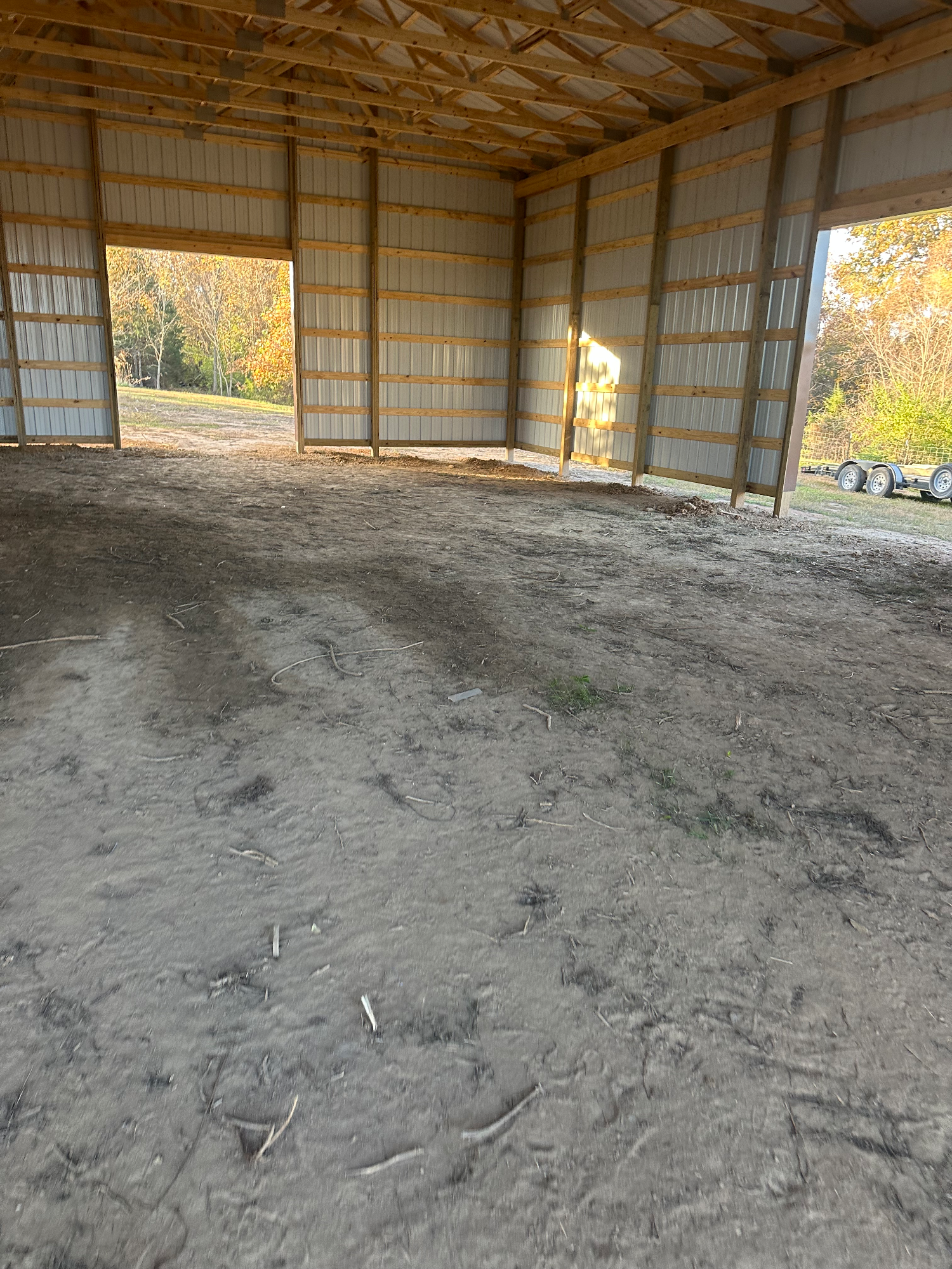 Building pad site in Silex with unfinished edges and loose soil around new structure